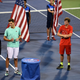 I am really enjoying the faces of the dudes holding the flags in the back, too. Talk about on-screen commentary.